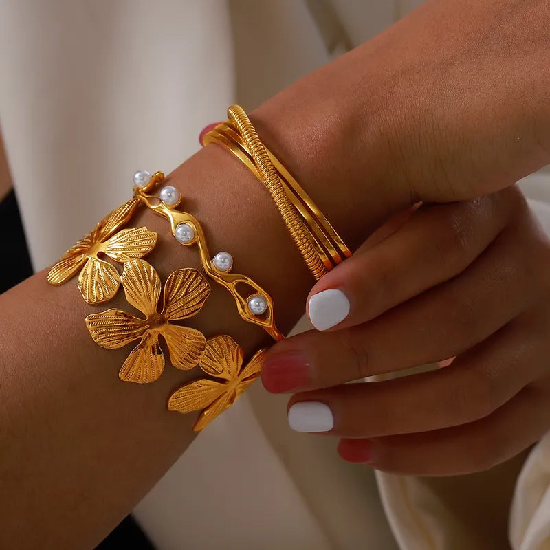 Pearl and flower petal design bangle